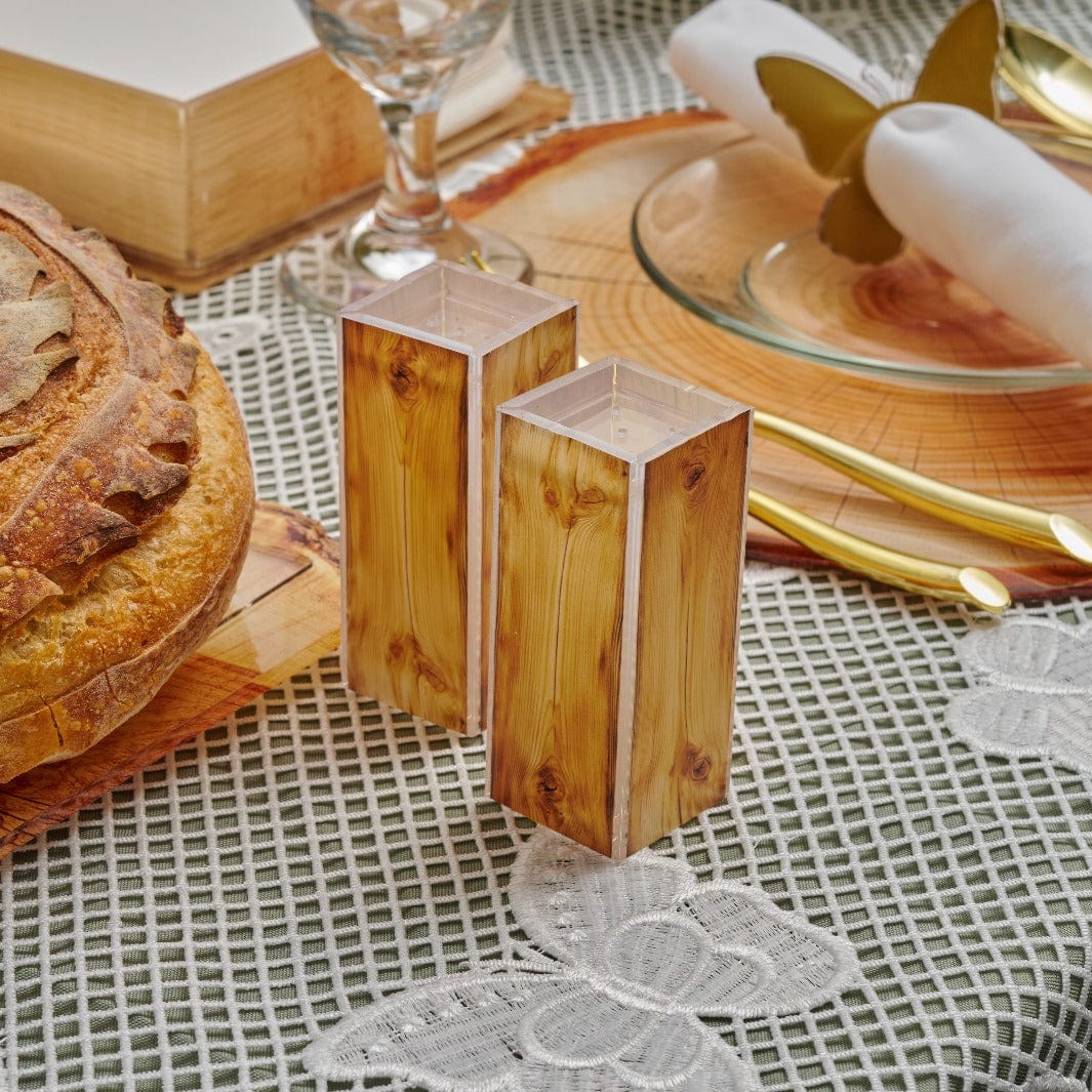 Wood Salt Shakers on a table.