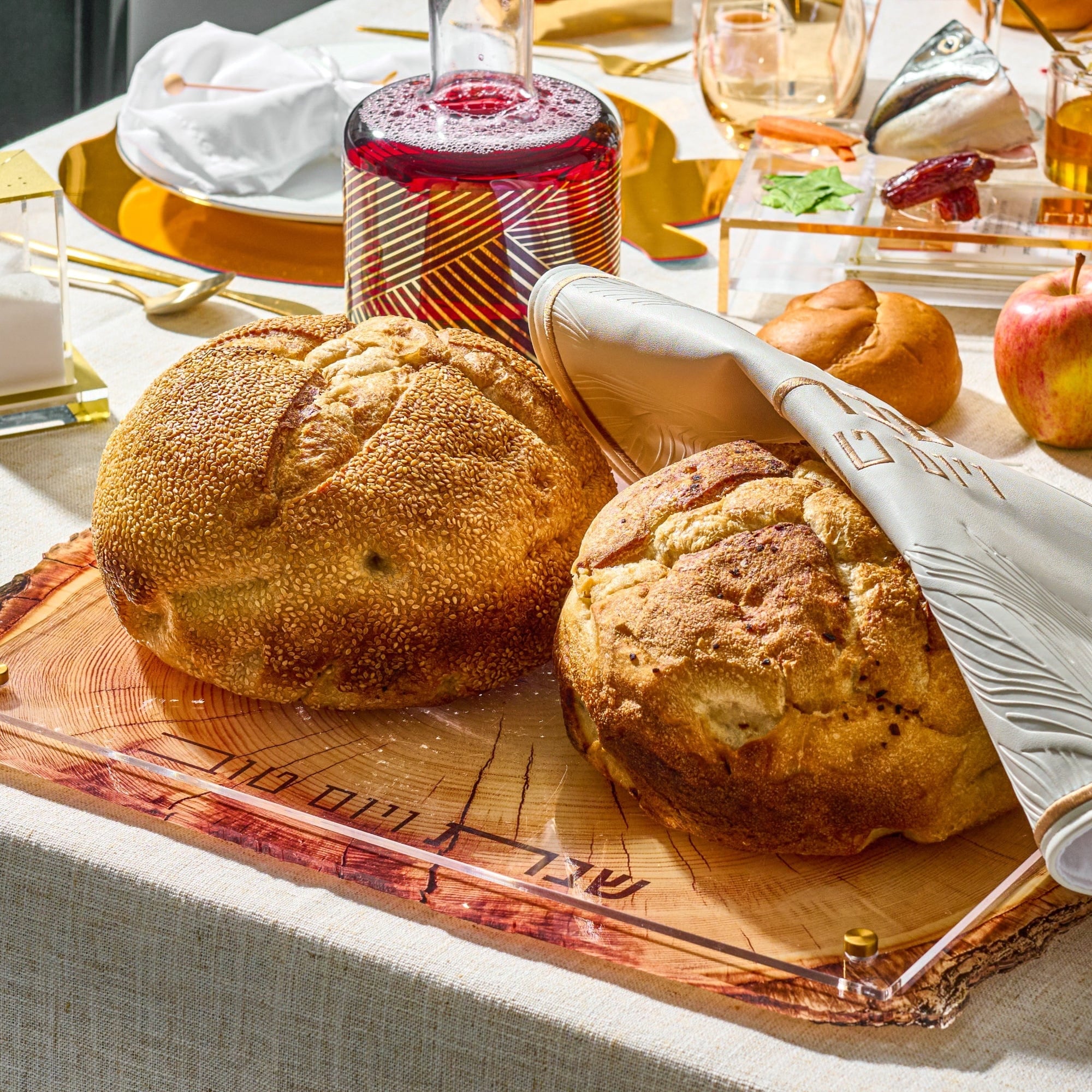 Wooden Challah Board on a beautiful Shabbat table setting.