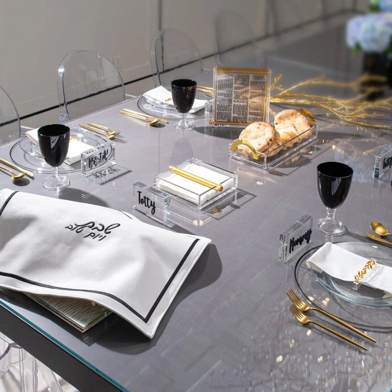 Black & Gold Tablescape with elegant place settings, gold candleholders, and formal dinnerware arrangement on gray table runner by Waterdale Collection.
