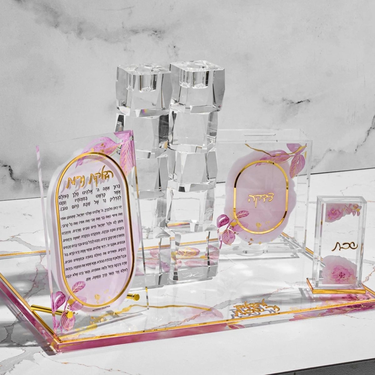 Watercolor Hadlokas Neiros gift box set featuring pink and peach tones with decorative tower candle holder, matches, and blessing card for Shabbat.