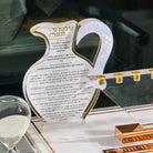 The Pearlstone Oil Jug Chanukah Block in gold, its Hadlakas Ner Chanukah lettering printed across the marbled face for Hanukkah