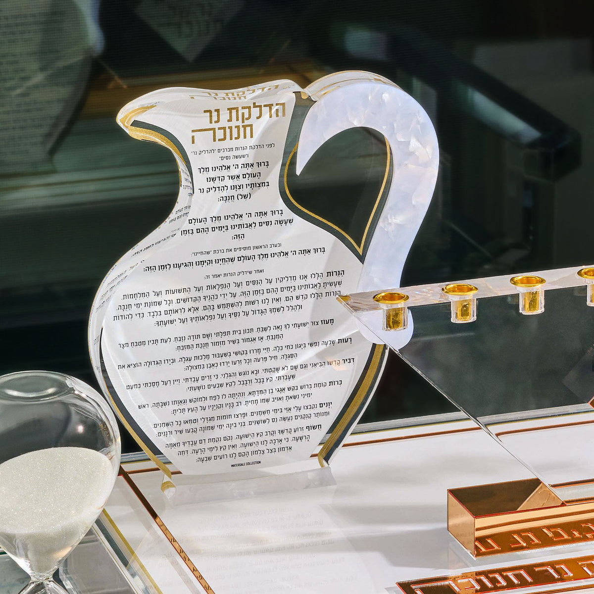 The Pearlstone Oil Jug Chanukah Block in gold, its Hadlakas Ner Chanukah lettering printed across the marbled face for Hanukkah