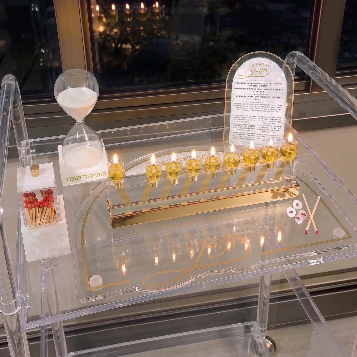 Pearl Marble Chanukah set by Waterdale Collection on a Lucite cart, with menorah tray, brachos, sand timer and match holder