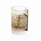 The Taupe Kosel Washing Cup from the Waterdale Collection carries the Kosel around a clear Lucite cup. A brushed gold handle finishes it.