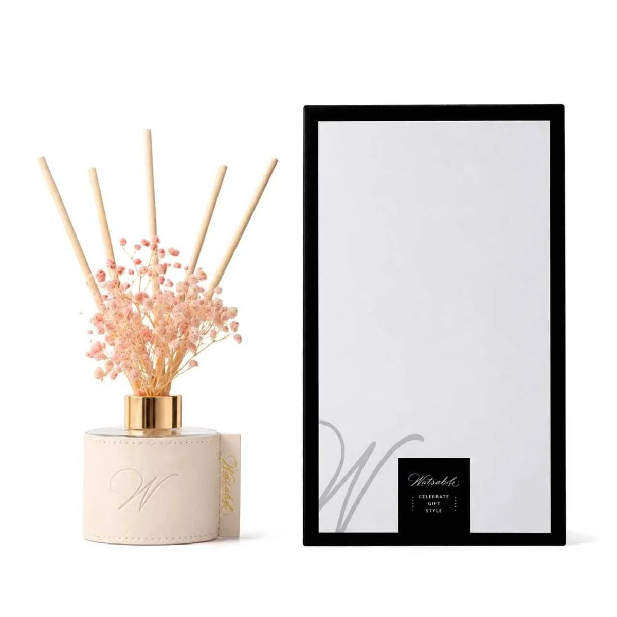 White leatherette flower diffuser with pink baby's breath beside its gift box