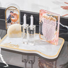 Watercolor Flowers Hadlakos Neiros Block with clear glass candlesticks and white flowers on marble surface for candle-lighting.