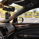 Tefillas Haderech tag and car diffuser hanging from a rearview mirror inside a car