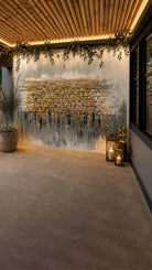 Kosel Reflected in Prayer vinyl sukkah mural on a full sukkah wall with candle lanterns and a potted olive tree