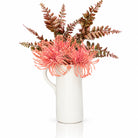 Pink faux floral white pitcher vase from Waterdale Collection, ceramic pitcher with coral pincushion blooms and burgundy fern