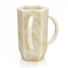 Resin Hexagon Washing Cup by Waterdale Collection in gold, a cream marbled netilas yadayim cup with a loop handle