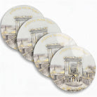 Clear lucite Bais Hamikdash chargers with gold-rimmed edges and artistic Hebrew detailing — Waterdale Collection.