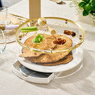 Classic Script Bencher Set Matzah Box in gold lucite displayed on white plate with Pesach tabletop styling and greenery accent