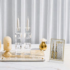 Lucite card with Hadlokas neiros tefilah and diamond art craft. Set on a table with hadlokas neiros display. DIY diamond art project perfect for bas mitzvahs and events.