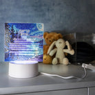 Diamond art shema lamp which lights up in the dark. Set on a dresser in a dark bedroom.