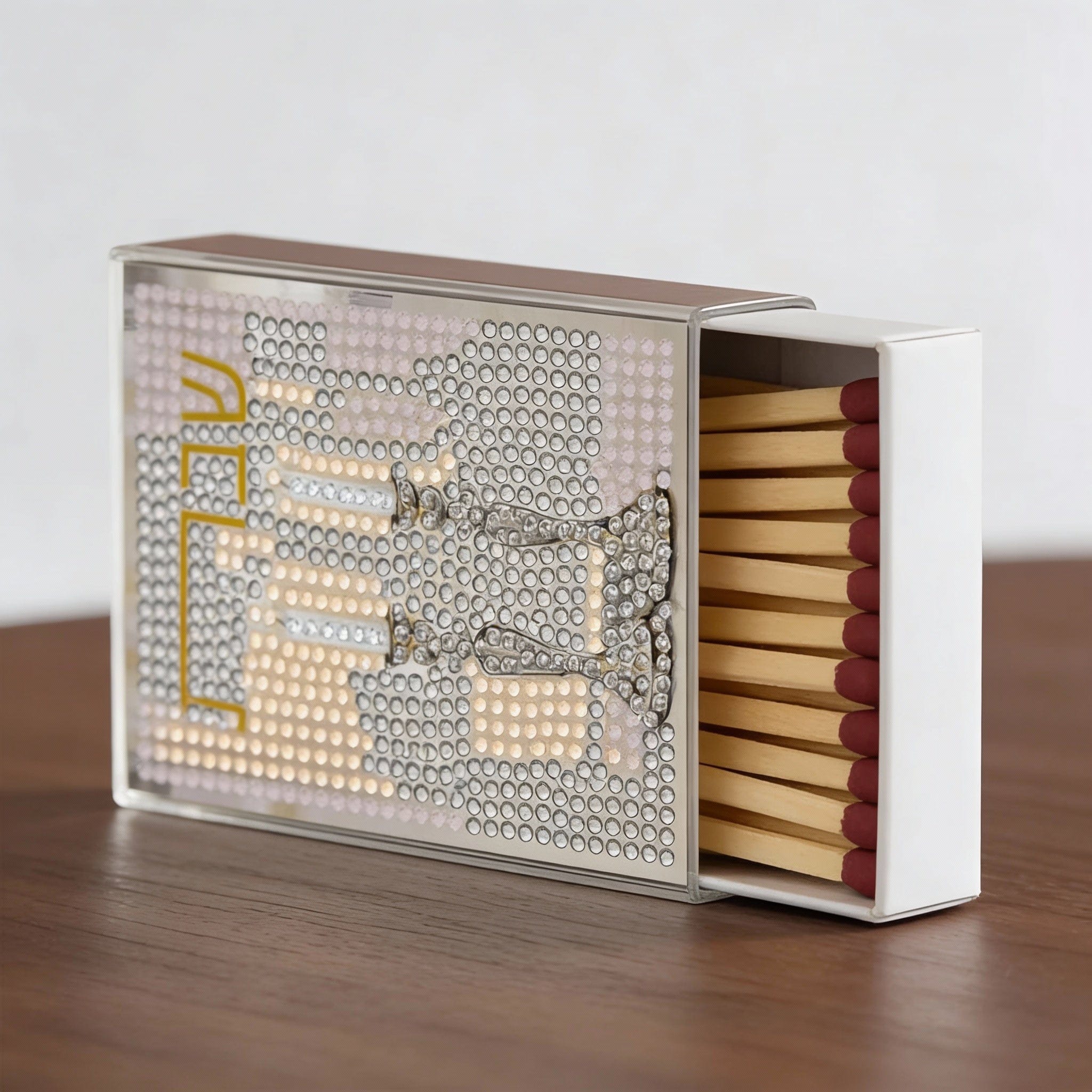 Color-It acrylic diamond art Shabbos matchbox cover featuring a crystal-style menorah and Shabbos lettering, displayed with wooden matches in a decorative sliding case.