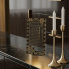 Color it acrylic Hadlokas Neiros card set on a buffet with candlesticks.
