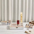 Painted Havdalah Set by Waterdale Collection displayed on white surface with striped backdrop, featuring wooden spice tower and matching ceremonial pieces.