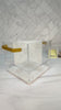 Swivel acrylic flatware caddy with pearl center divider and gold handles on a counter setting with items in it and spinning around. by Waterdale Collection