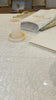Resin Mayim Acharonim on a shabbos table with water pouring out.
