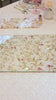 Waterdale Collection Pink and Gold Floral Bird Challah Cover and challah board in soft cream fabric with delicate pink and green floral border or gold floral border. Set on an elegant Shabbos table décor, luxury Judaica challah cover for Jewish home or wedding gift