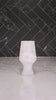 Resin style havdalah cup with words Borei Pri Hagafen on a Havdalah display. Cup being filled up with wine.