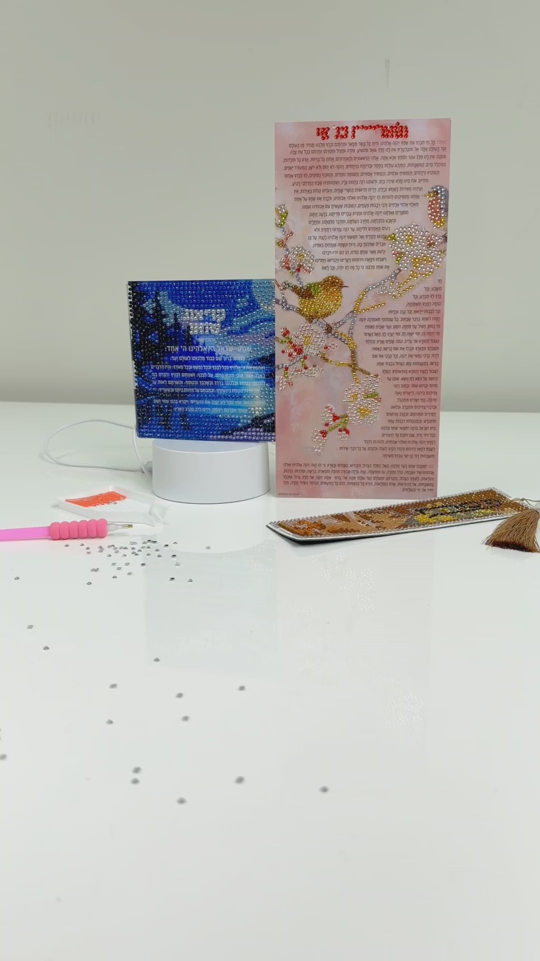 diamond art thank you hashem key chain shown being done in a video.