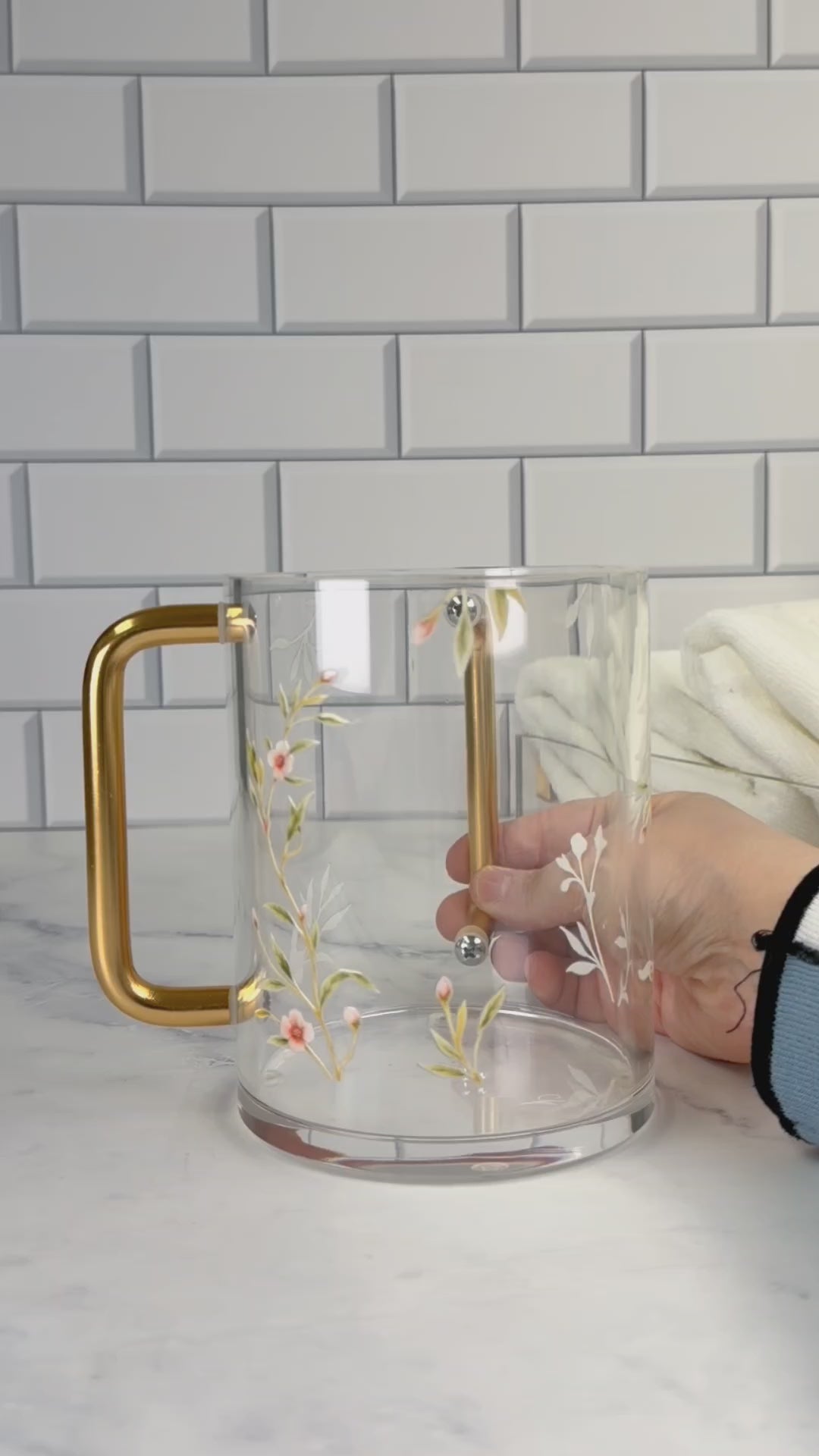 Floral Bird Washing cup with gold handles and pink or gold flower accents. Water in the washing cup