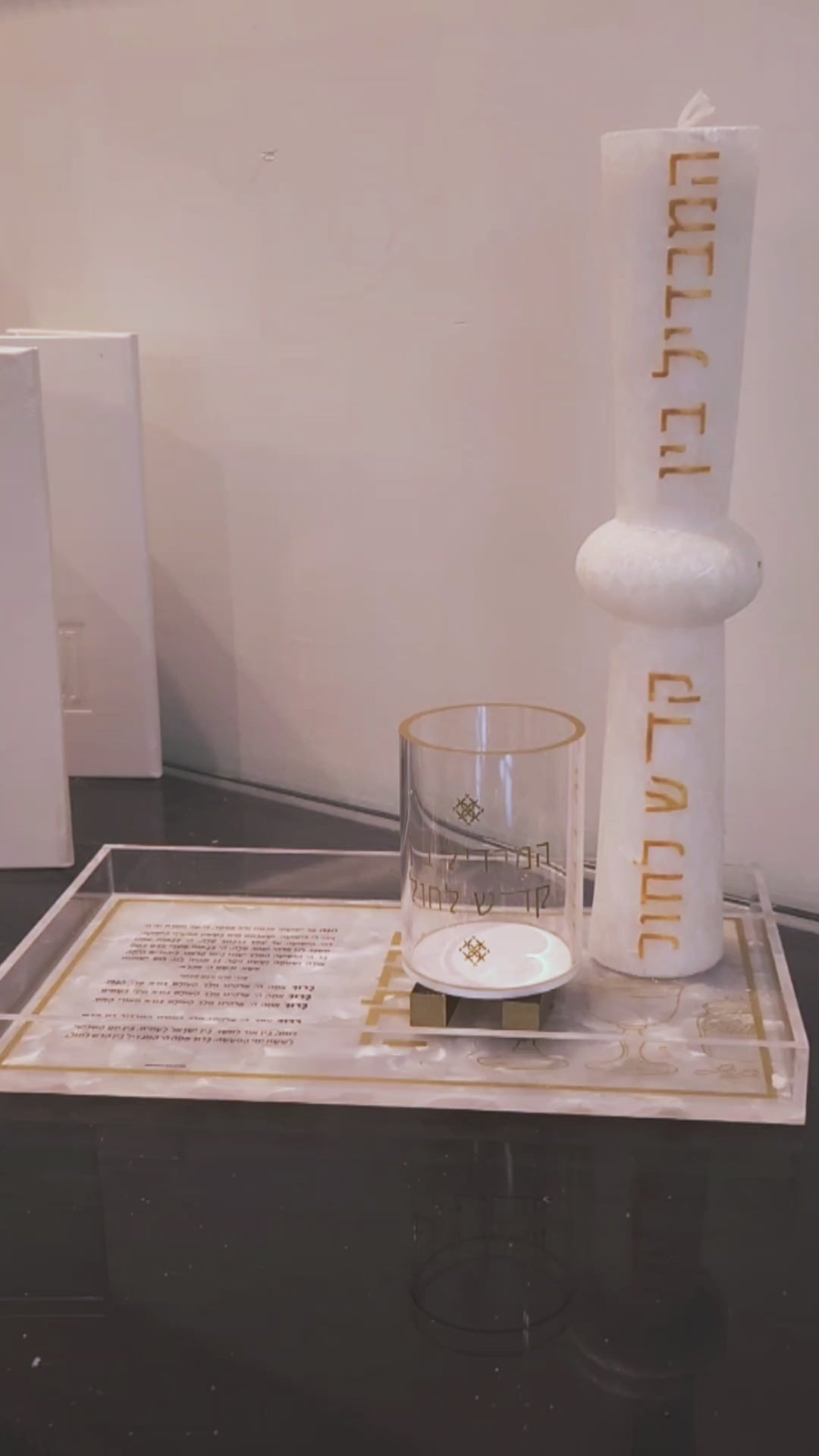 Pearlstone Block Match Holder and Besamim Holder featuring a clear lucite container with gold  lettering and a sleek gold-tone knob, set atop a solid pearlstone block base for an elegant and modern Havdalah display.
