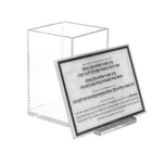 Clear acrylic Chanukah candle holder with product information card displayed in front against white background