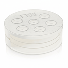 Modern square Pesach Seder plate with tiered lucite Matzah storage and silver Hebrew engraving on a marble-effect top — Waterdale Collection.