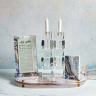 Agate Hadlokas Neiros set featuring white candlesticks with natural stone base and informational cards by Waterdale Collection.