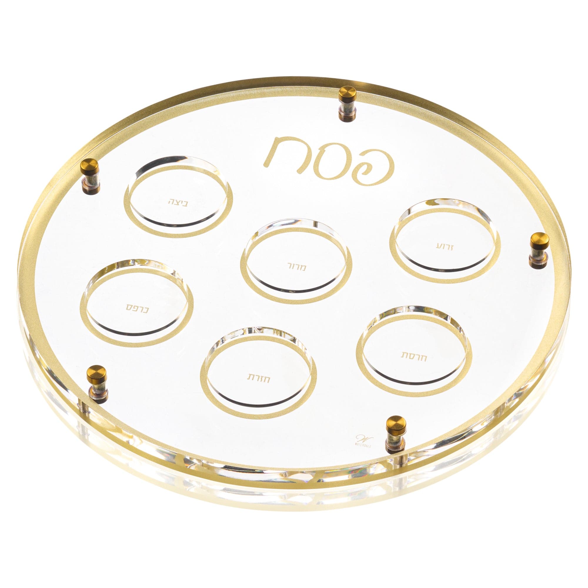 Premium clear lucite Seder plate featuring a built-in Bencher set holder, gold-rimmed compartments, and elegant Hebrew lettering — Waterdale Collection.