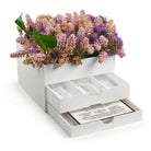 White Silverware caddy with a purple floral top and open drawer revealing cutlery and benchers - Waterdale Collection