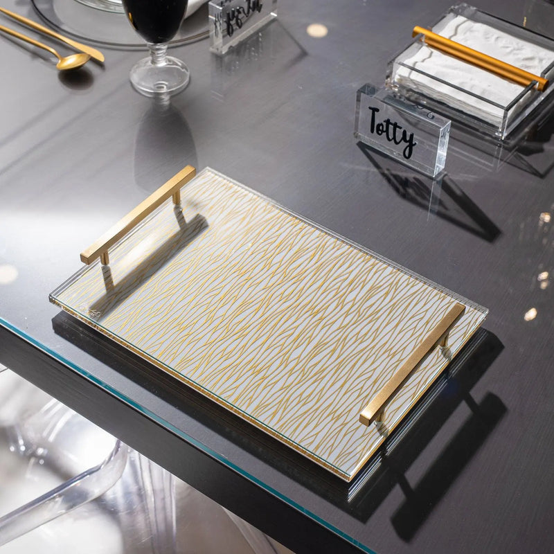 Black & Gold Tablescape by Waterdale Collection featuring cream linen placemat with gold handles on dark surface