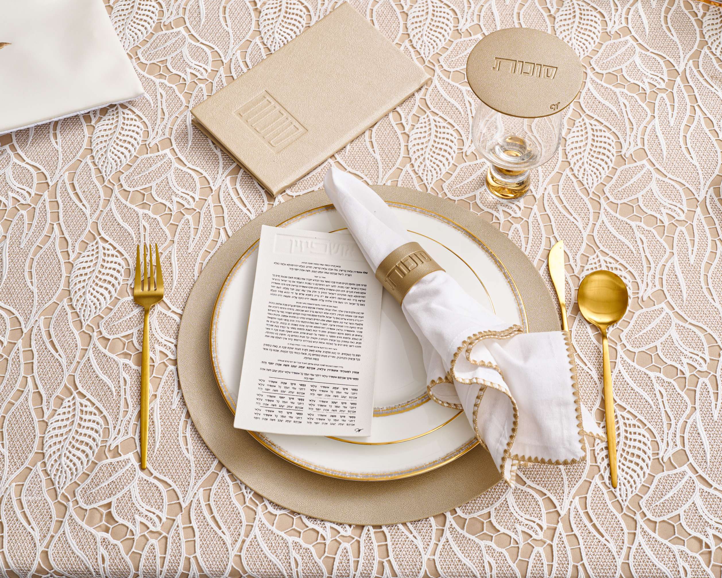leather sukkos booklet, napkin wraps, and round chargers, leaf lace tablecloth