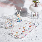 Butterfly Netilas Yadayim Set by Waterdale featuring clear acrylic cups with colorful butterfly designs and matching towel on marble surface