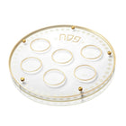 Clear glass Seder plate with six circular compartments and gold trim accents, from Waterdale Collection's Passover dinnerware set.