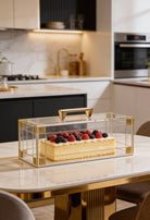 Decorative Lucite cake stand with a cake on a kitchen counter - Waterdale Collection