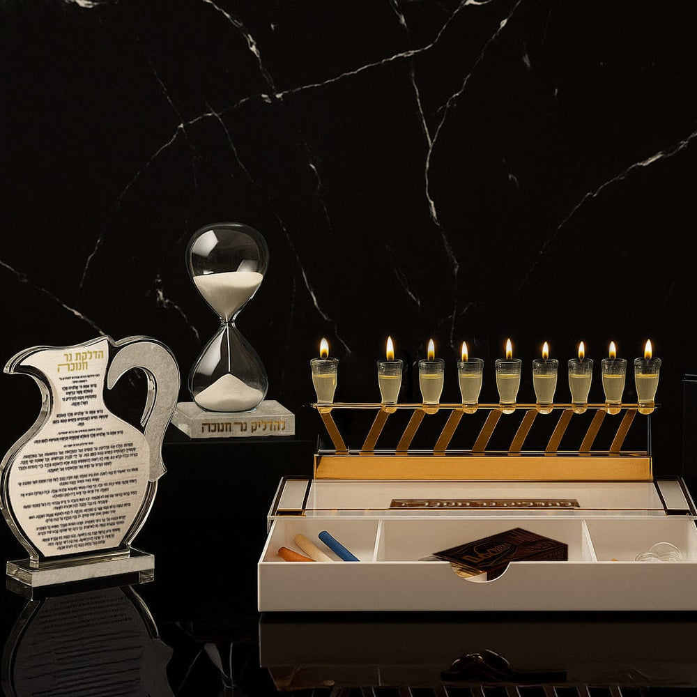 Waterdale Collection - Menorah with candles, sand hourglass, and other items on a dark marble surface