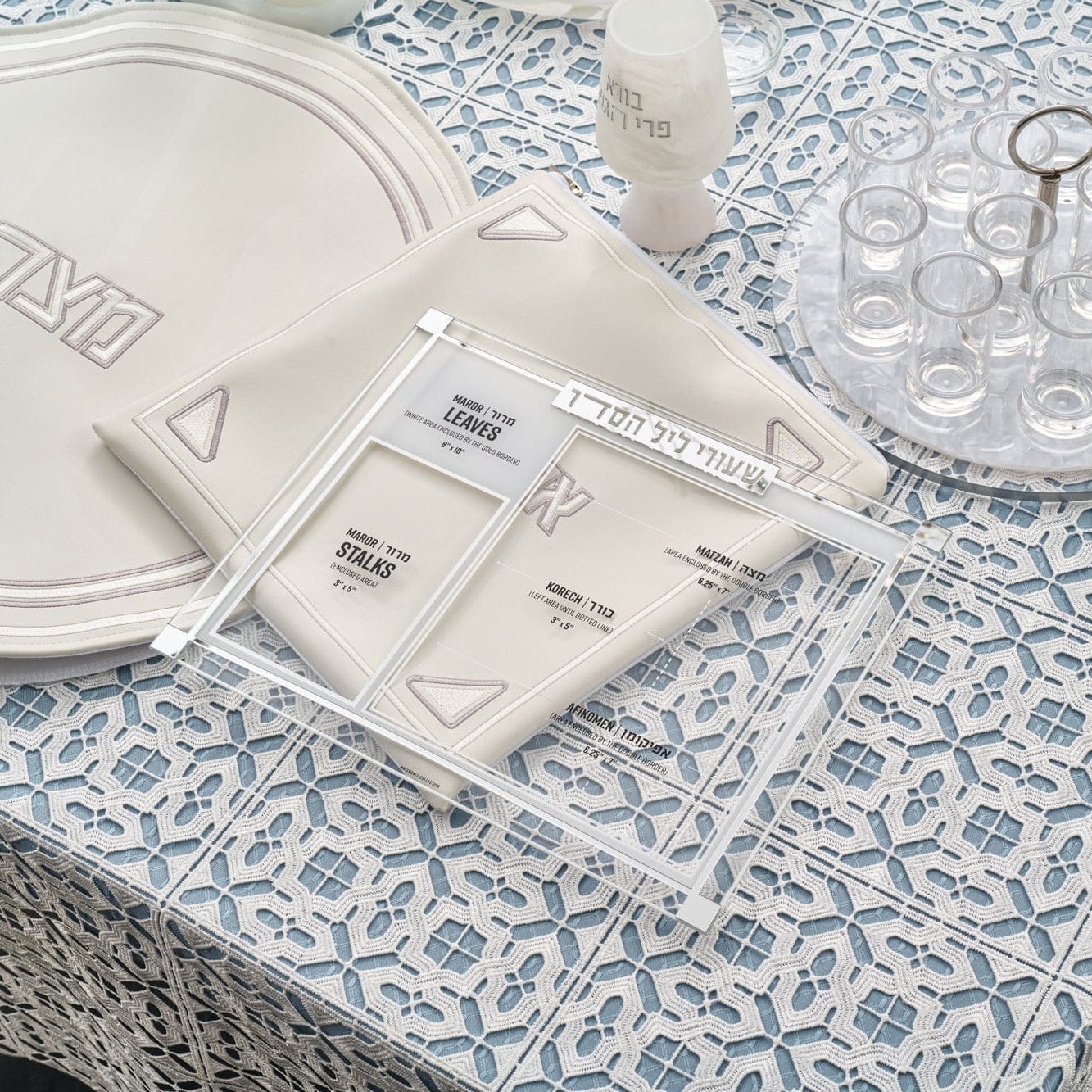Classic 2.0 Shiurim Card in a clear acrylic frame featuring labeled Pesach measurements for maror, matzah, and korech, displayed on an elegant Seder table with matching accessories.