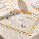 Classic 2.0 Shiurim Card with gold-trimmed acrylic frame displaying Pesach measurements for maror, matzah, korech, and afikomen, styled on a textured Seder table setting. | Waterdale Collection 