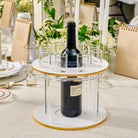 Classic round liquor set featuring a sleek acrylic stand with gold accents, central bottle holder, and multiple shot glass compartments.
