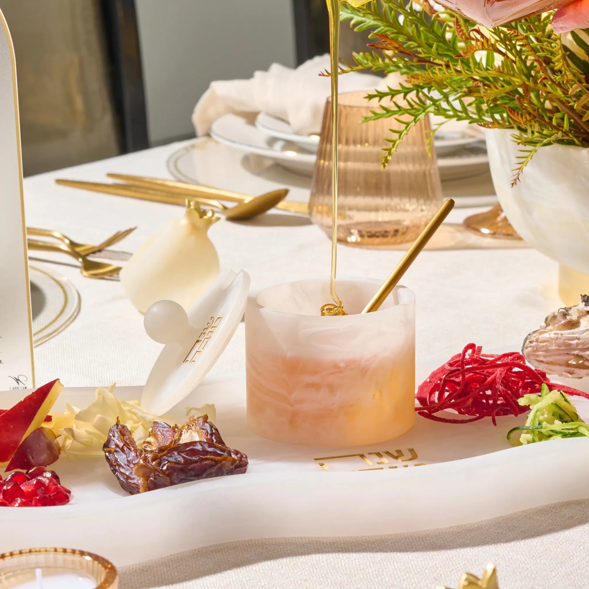Classic round resin honey dish styled on a Jewish New Year table