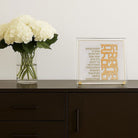 Classic Vezakeini Tabletop displayed on a dark wood sideboard beside a vase of white hydrangeas.