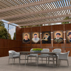 All three Dark Gedolim vinyl sukkah decorations on an outdoor succah wall above a set Sukkot table