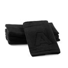 Black Edge Towel Set by Waterdale Collection featuring two folded towels with embossed edge detail, displayed on white background.