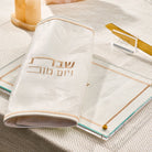 Leather and Lucite challah board and cover on a set shabbos table from waterdale collection