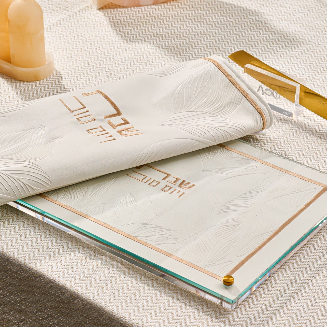 Leather and Lucite challah board and cover on a set shabbos table from waterdale collection