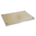 Embossed Regal challah board with matching cover set, featuring a cream-colored wooden surface with decorative corner accents and embossed design detail.