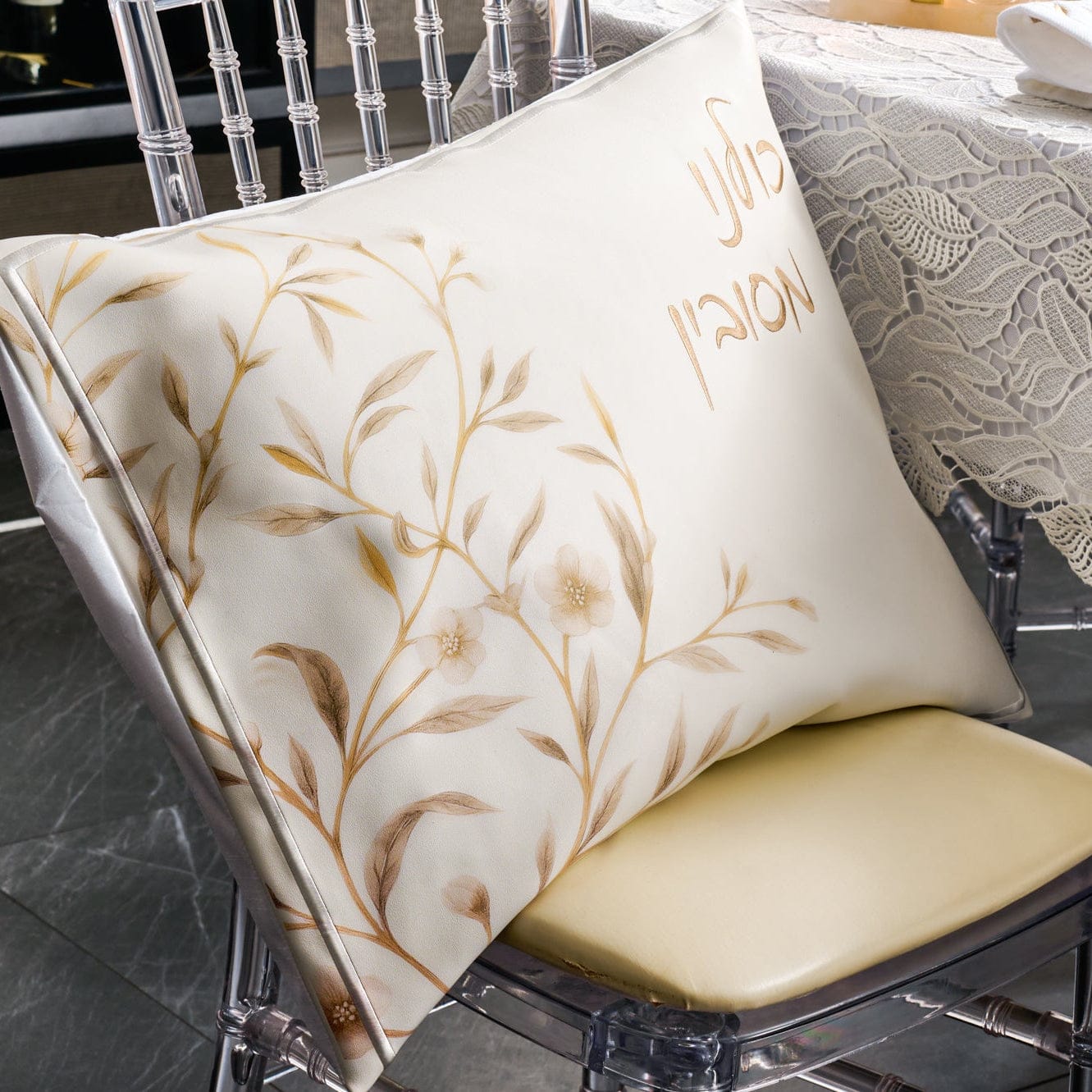 Floral Bird Pesach set featuring elegant cream fabric with gold floral branch design displayed on a chair, ideal for Seder table décor.